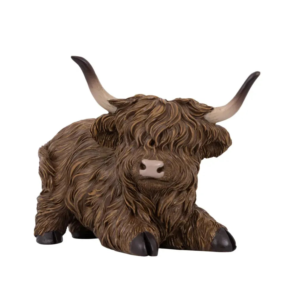 HIGHLAND COW SITTING